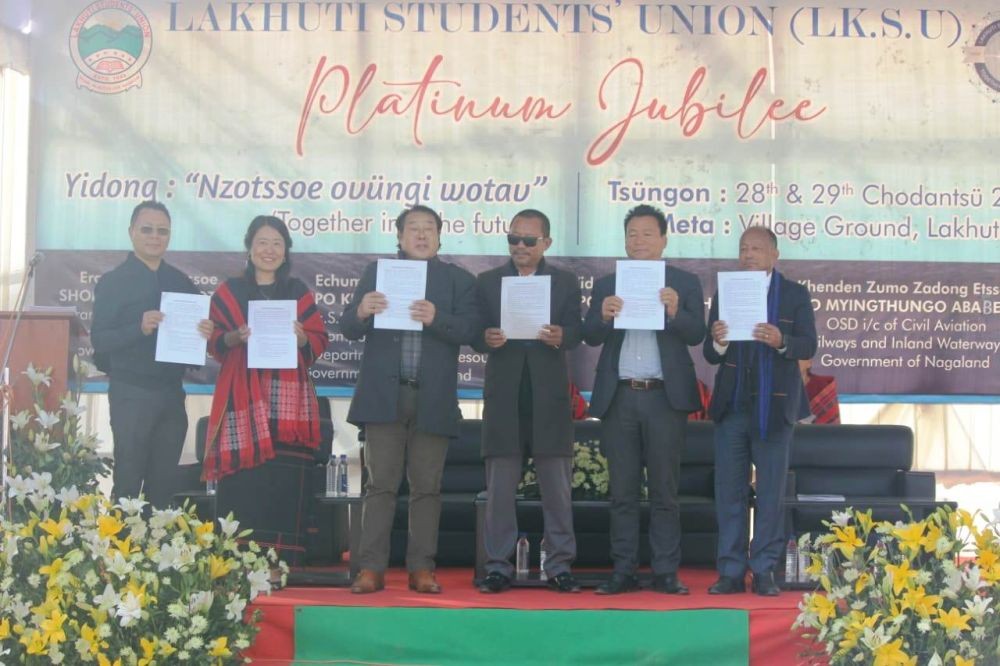 Khonchamo Ngullie with others releasing the Jubilee Souvenir of Lakhuti Students' Union at Lakhuti village ground in Wokha district on December 28.